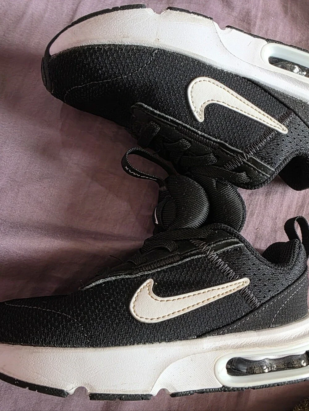 Nike Kids Black Sneakers with White Sole and Small Pink Swoosh